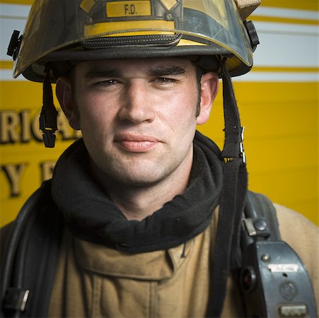 simsearch:640-01359145,k - Portrait of a firefighter wearing a helmet Stock Photo - Premium Royalty-Free, Code: 640-01352435