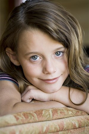 Close-up of young girl's smiling face Stock Photo - Premium Royalty-Free, Code: 640-01352449