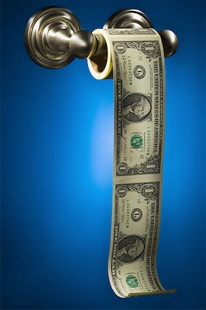 Close-up of American paper currency on a toilet paper roll Stock Photo - Premium Royalty-Free, Code: 640-01352615