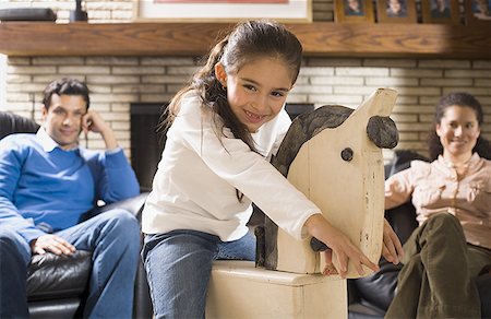 simsearch:640-01356582,k - Portrait of a girl on a rocking horse Stock Photo - Premium Royalty-Free, Code: 640-01352624