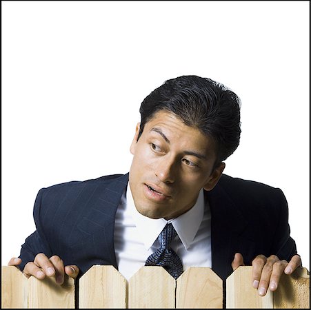 simsearch:640-02771261,k - Businessman looking over wooden fence Stock Photo - Premium Royalty-Free, Code: 640-01352648