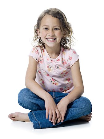 Portrait of a girl sitting with her legs crossed Stock Photo - Premium Royalty-Free, Code: 640-01352689