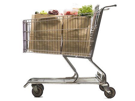 shopping bag shopping cart - Close-up of a shopping cart with groceries Stock Photo - Premium Royalty-Free, Code: 640-01352707