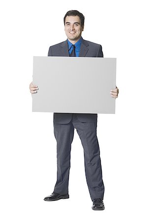 smart businessman white background - Businessman holding a blank sign Stock Photo - Premium Royalty-Free, Code: 640-01352777