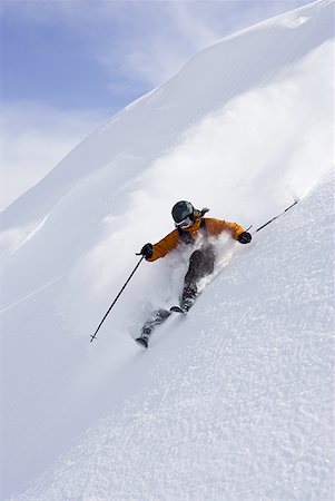 simsearch:640-01362181,k - Downhill skier skiing on mountain Foto de stock - Sin royalties Premium, Código: 640-01352790