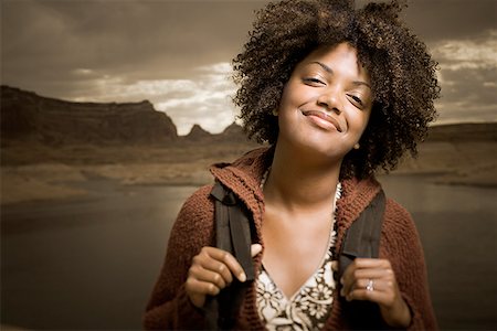 pictures black people hiking - Portrait of a young woman carrying a backpack Stock Photo - Premium Royalty-Free, Code: 640-01352915