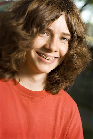 Portrait of a teenage boy smiling Stock Photo - Premium Royalty-Free, Code: 640-01352912