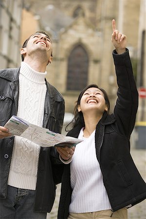 simsearch:640-01354485,k - Close-up of a young couple holding a map and looking up Stock Photo - Premium Royalty-Free, Code: 640-01352971