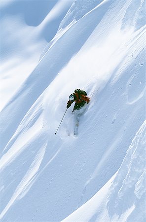 simsearch:640-01362181,k - Downhill skier skiing on mountain Foto de stock - Sin royalties Premium, Código: 640-01352972