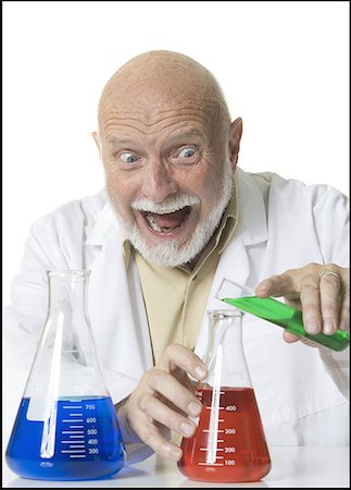 simsearch:640-01354976,k - Close-up of a male scientist pouring liquid from a test tube into a conical flask Foto de stock - Sin royalties Premium, Código: 640-01353000