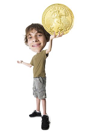 Teenage boy holding a US gold coin Foto de stock - Sin royalties Premium, Código: 640-01353030