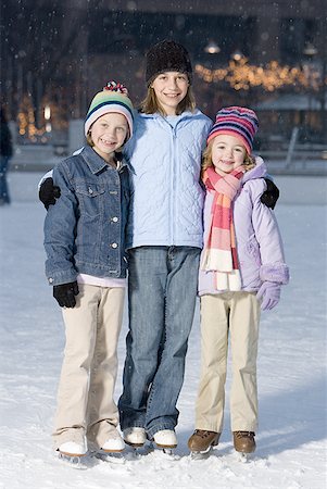 simsearch:640-01601334,k - Three girls with skates outdoors in winter smiling Stock Photo - Premium Royalty-Free, Code: 640-01353076