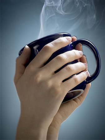 steaming hot women - Close-up of a woman's hands holding a cup Stock Photo - Premium Royalty-Free, Code: 640-01353072