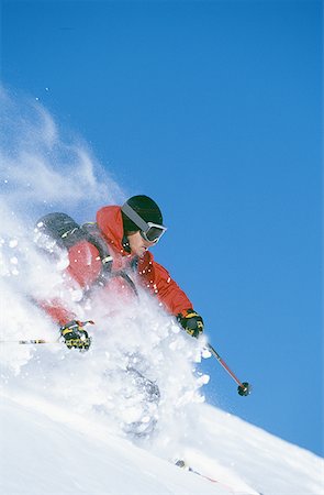 simsearch:640-01362181,k - Downhill skier skiing on mountain Foto de stock - Sin royalties Premium, Código: 640-01353081