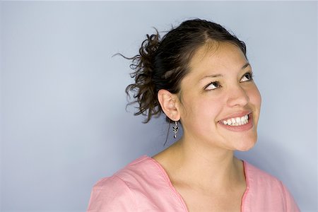simsearch:640-01365245,k - Close-up a teenage girl smiling and looking up Stock Photo - Premium Royalty-Free, Code: 640-01353082
