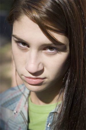 simsearch:640-01365454,k - Portrait of a teenage girl smirking Stock Photo - Premium Royalty-Free, Code: 640-01353336