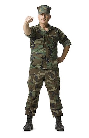 Portrait of a man in a military uniform Stock Photo - Premium Royalty-Free, Code: 640-01353331