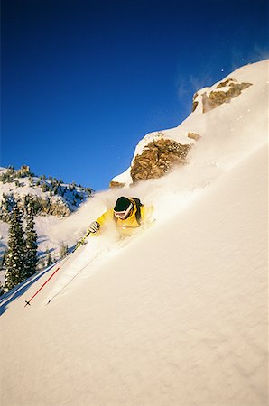 simsearch:640-01362181,k - Downhill skier skiing on mountain Foto de stock - Sin royalties Premium, Código: 640-01353344