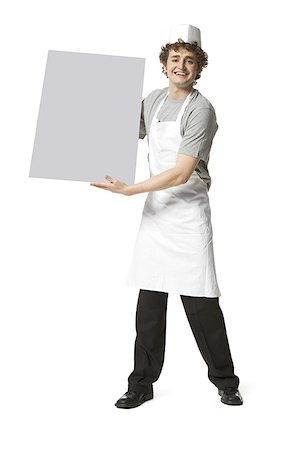 person and cut out and waiter - Portrait of a young man holding a blank placard Stock Photo - Premium Royalty-Free, Code: 640-01353392