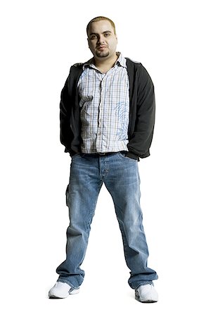 simsearch:640-01351214,k - Portrait of a young man standing with his hands in his pockets Stock Photo - Premium Royalty-Free, Code: 640-01353401