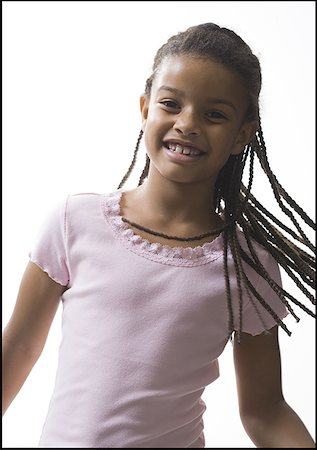 dreadlocks on african americans - Portrait of a girl smiling Foto de stock - Sin royalties Premium, Código: 640-01353446