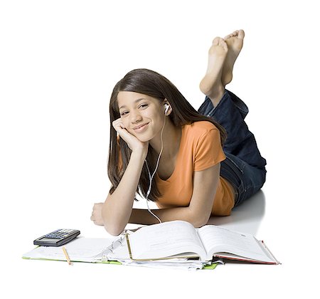 Portrait of a girl listening to music and studying Stock Photo - Premium Royalty-Free, Code: 640-01353558