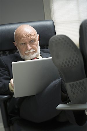 simsearch:640-01351902,k - Businessman using a laptop in an office Foto de stock - Sin royalties Premium, Código: 640-01353564