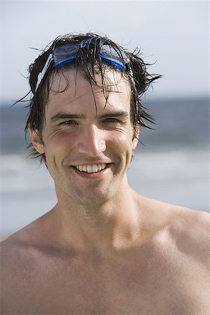 Portrait of a young man on the beach Stock Photo - Premium Royalty-Free, Code: 640-01353585