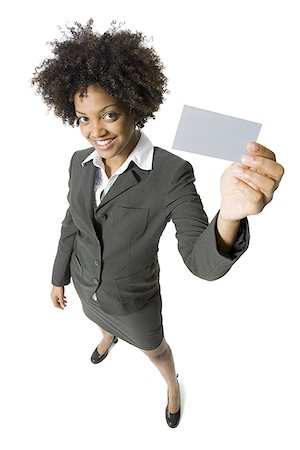 High angle view of a businesswoman showing a blank sign Stock Photo - Premium Royalty-Free, Code: 640-01353582