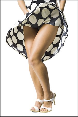 Woman's polka dot dress blowing in breeze Foto de stock - Sin royalties Premium, Código: 640-01353626