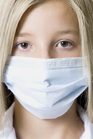 simsearch:614-08030633,k - Portrait of a girl wearing a surgical mask Stock Photo - Premium Royalty-Free, Code: 640-01353661