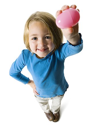 found object - Portrait of a girl showing an Easter egg Stock Photo - Premium Royalty-Free, Code: 640-01353685