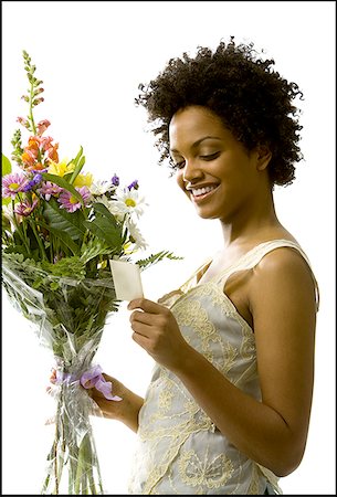 Woman receiving bouquet of flowers Stock Photo - Premium Royalty-Free, Code: 640-01353731