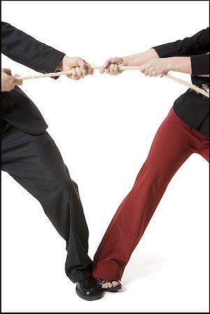 Business people engaged in a tug of war contest Stock Photo - Premium Royalty-Free, Code: 640-01353771