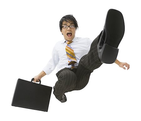 Portrait of a businessman jumping in midair Stock Photo - Premium Royalty-Free, Code: 640-01353935