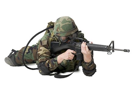 Soldier lying down and aiming his rifle Stock Photo - Premium Royalty-Free, Code: 640-01353967