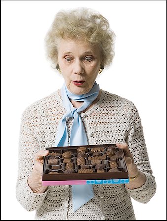 simsearch:640-01362854,k - Older woman holding a box of chocolates Stock Photo - Premium Royalty-Free, Code: 640-01353961