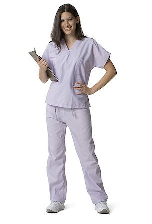 standing nurse in scrubs full length - Portrait of a female nurse holding a clipboard Stock Photo - Premium Royalty-Free, Code: 640-01364042