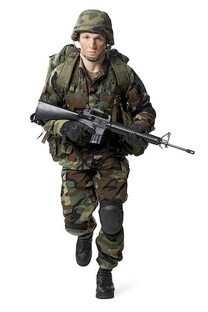 Portrait of a soldier walking with a rifle Foto de stock - Sin royalties Premium, Código: 640-01364108