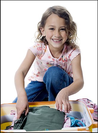 Portrait d'une jeune fille d'emballage une valise Photographie de stock - Premium Libres de Droits, Code: 640-01364130