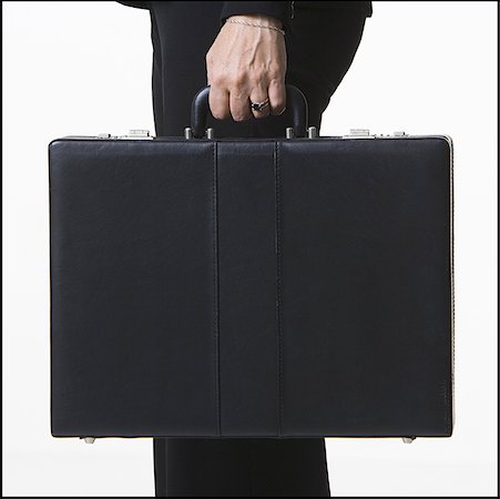Close-up of a businesswoman holding a briefcase Stock Photo - Premium Royalty-Free, Code: 640-01364133