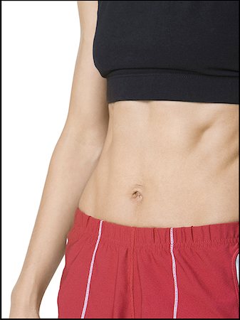 Close-up of a woman's abdominal muscles Stock Photo - Premium Royalty-Free, Code: 640-01364152