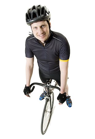 Portrait of a mature man on a bicycle Stock Photo - Premium Royalty-Free, Code: 640-01364175