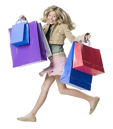 simsearch:640-02657375,k - Portrait d'une jeune fille tenant des sacs à provisions et en sautant Photographie de stock - Premium Libres de Droits, Code: 640-01364203