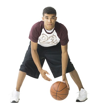 Portrait d'un jeune homme jouant un ballon de basket Photographie de stock - Premium Libres de Droits, Code: 640-01364216