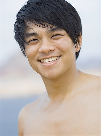 Close-up of a young man smiling Foto de stock - Sin royalties Premium, Código: 640-01364235