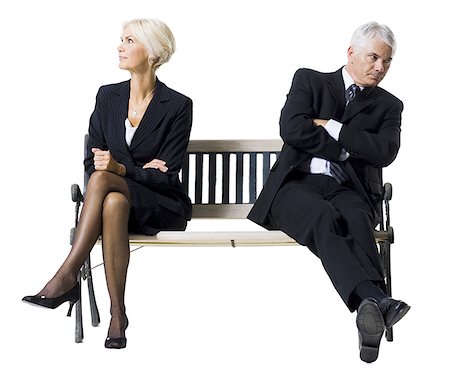 Businessman and businesswoman sitting on a bench Stock Photo - Premium Royalty-Free, Code: 640-01364291