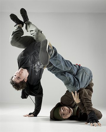fallen hair - Two young men break dancing Stock Photo - Premium Royalty-Free, Code: 640-01364337