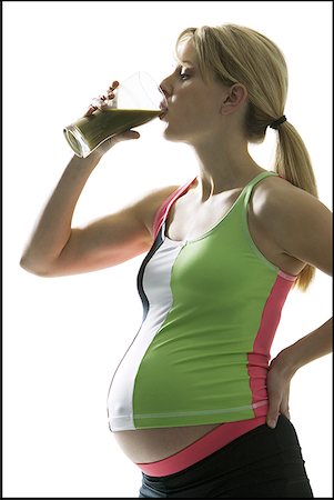 simsearch:640-01355937,k - Close-up of a young pregnant woman drinking juice Foto de stock - Sin royalties Premium, Código: 640-01364352