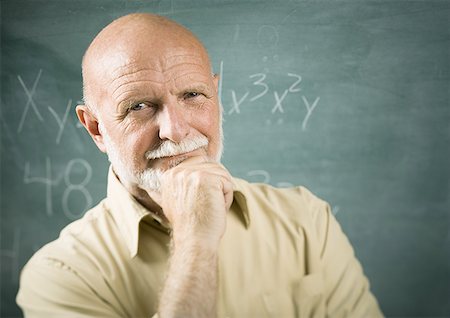 elderly characters - Portrait of a senior male professor standing in front of a blackboard Stock Photo - Premium Royalty-Free, Code: 640-01364377